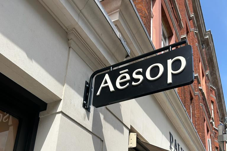 Aesop store sign on a building facade
